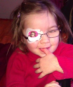 child with eye patch