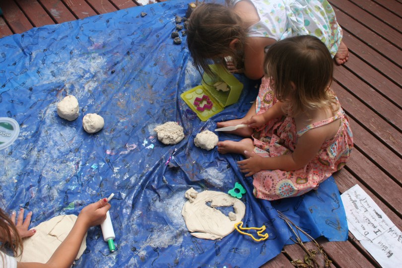 kids playing with clay